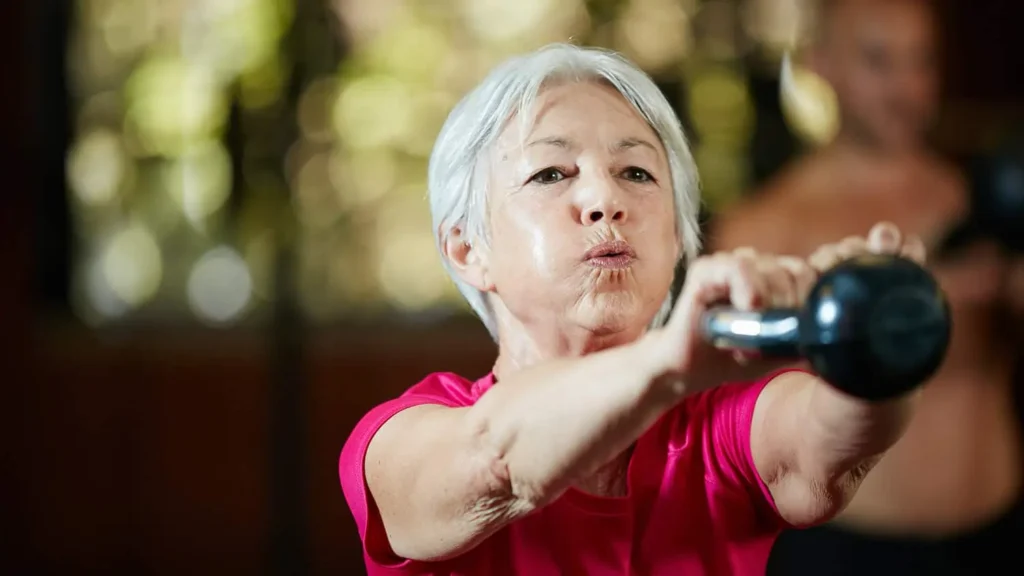 Toning Bingo Wings: Effective Exercises and Tips for Achieving Sleeker Arms 2 Person performing arm exercises with dumbbells Birch