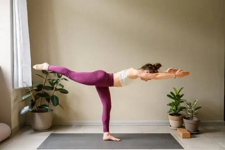 Achieving the Perfect Tone: How Often Should You Exercise for Results? 1 Woman doing Yoga exercise Birch to help with toning the body.