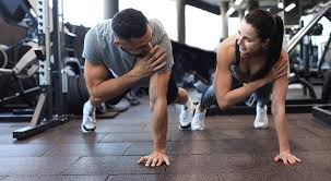 Sculpting Sleek Arms: The Essential Role of Cardio in Toning Without Bulking Up 1 Image of man and woman doing Cardio Birch to tone their arms.
